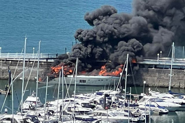 A superyacht which went up in flames while moored in a marina in Torquay (Tania Coatham/Twitter/PA)