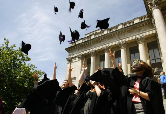 Stock image of graduates throwing their caps in celebration (Archive/PA)