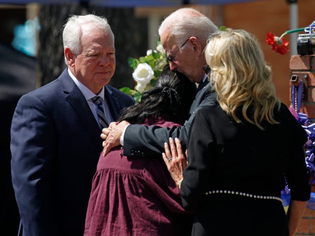 <p>President Joe Biden comforts Robb Elementary School Principal Mandy Guttierez after massacre </p>