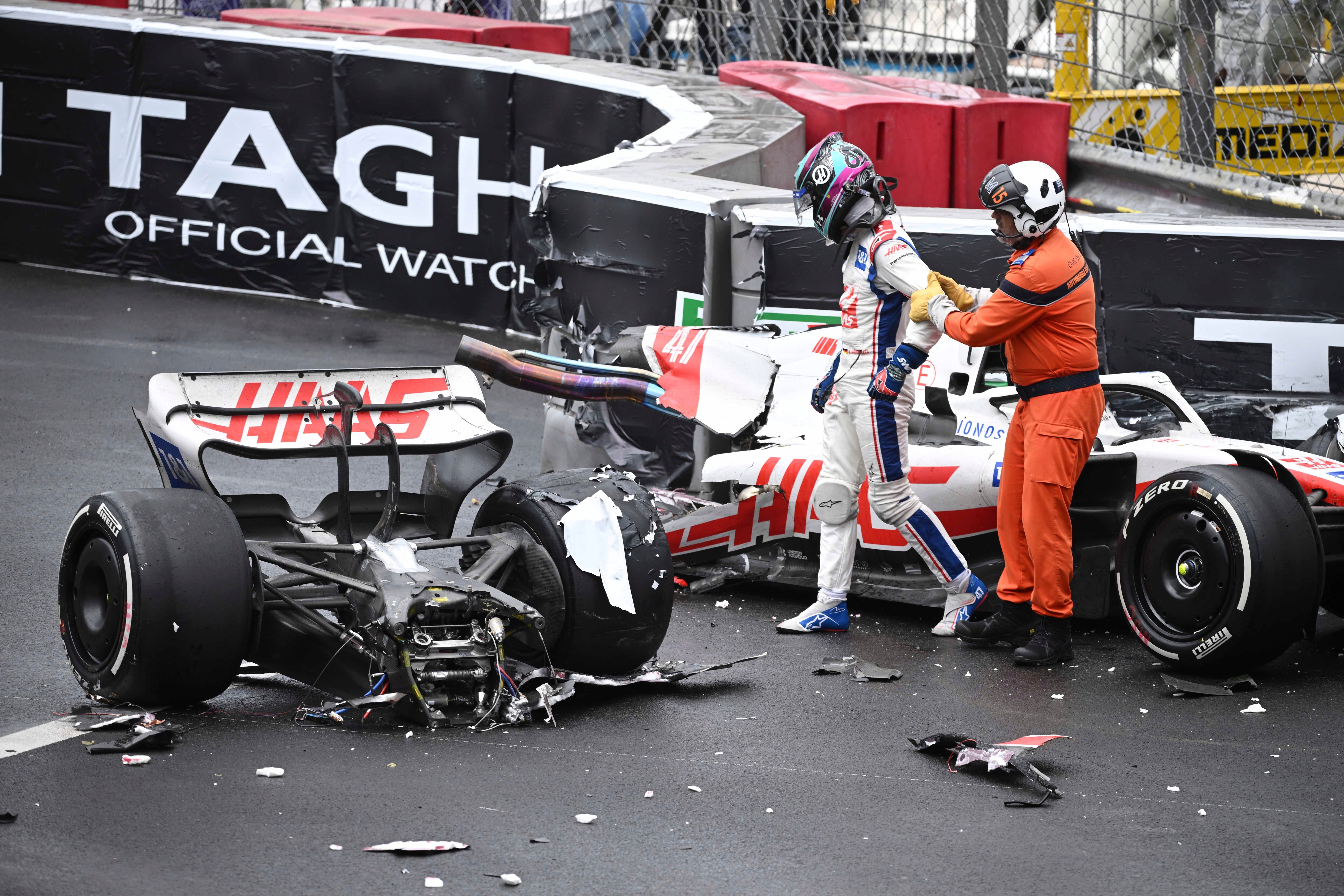 Haas driver Mick Schumacher walks away from his wrecked car after crashing during the Monaco F1 Grand Prix (Christian Bruna/AP/PA)
