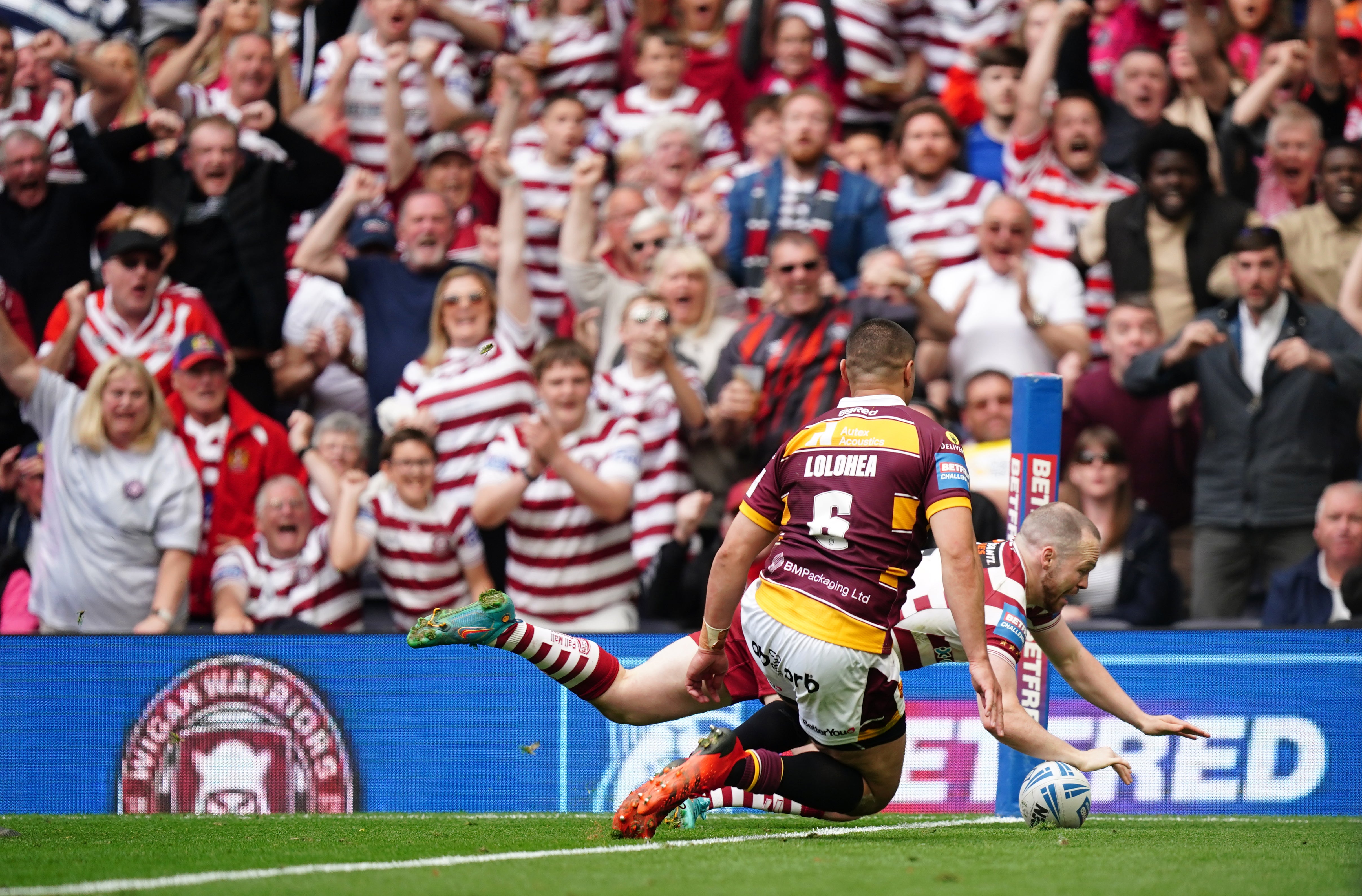 Wigan’s Liam Marshall scores the decisive try to see off Huddersfield in the Betfred Challenge Cup final at the Tottenham Hotspur Stadium (Mike Egerton/PA)