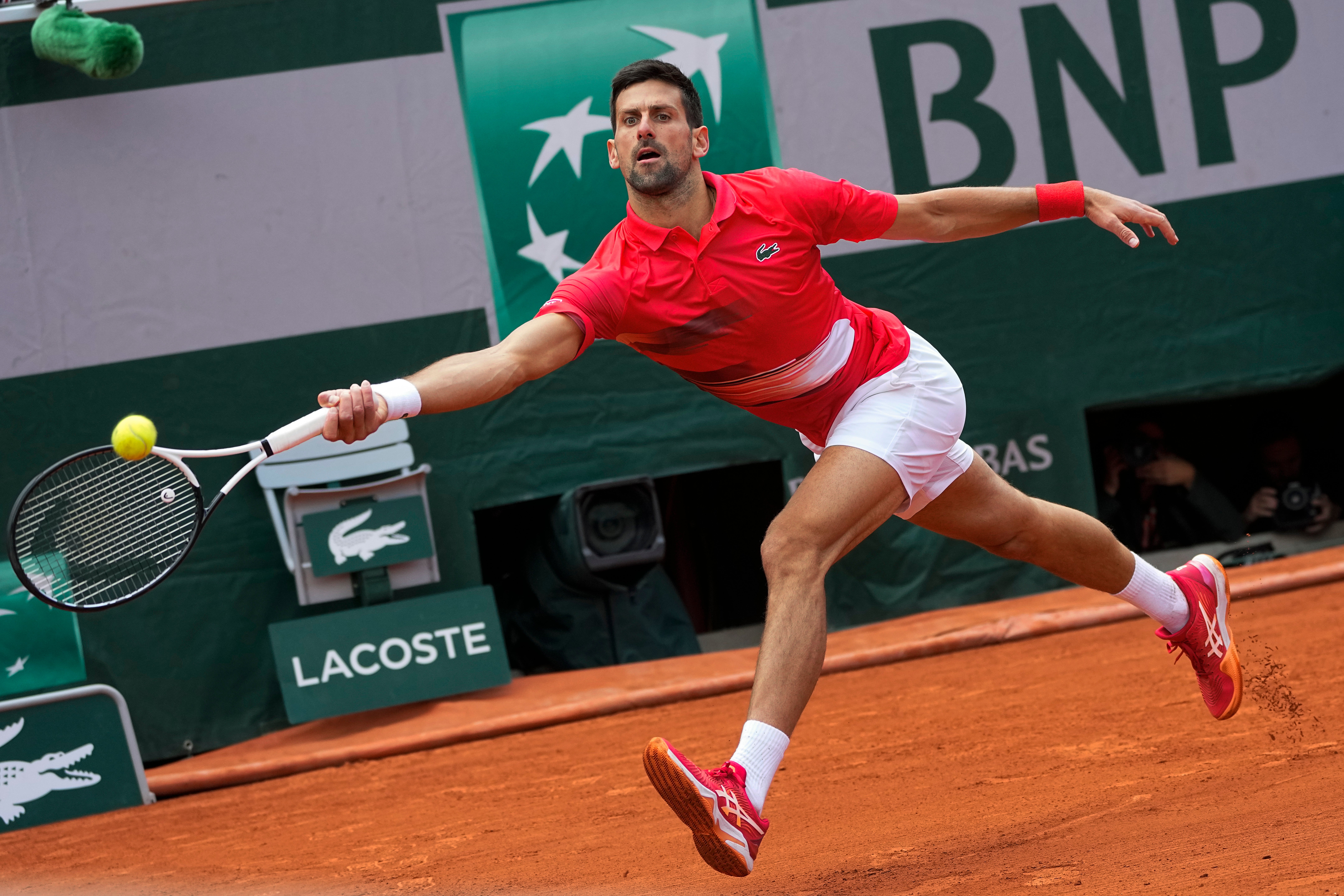Novak Djokovic at full stretch in his fourth-round clash with Diego Schwartzman at the French Open at Roland Garros (Michel Euler/AP/PA)