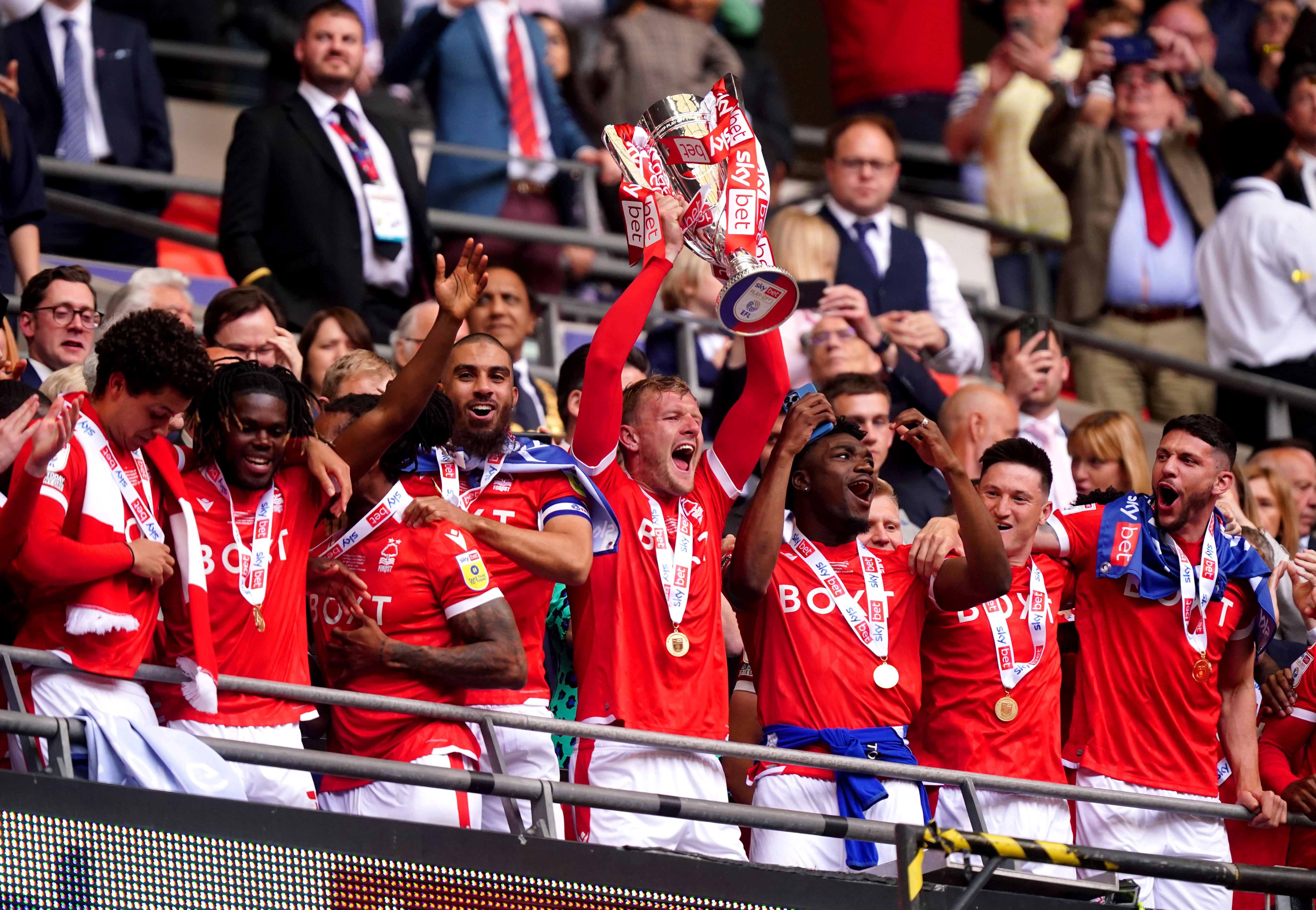 Nottingham Forest skipper Joe Worrall, centre, lifts the Sky Bet Championship play-off final trophy at Wembley (Mike Egerton/PA)