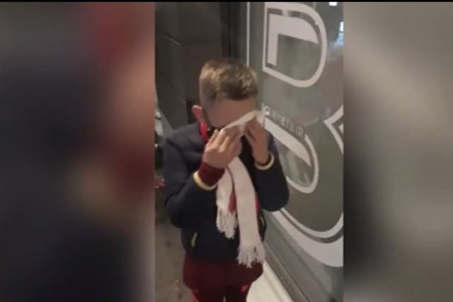 <p>Footage shows a boy wiping his eyes after being hit by tear gas at the Champions League final</p>