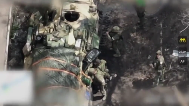 <p>Russian soldiers are seen from above before the drone strikes </p>