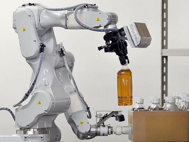 <p>Companies are spending millions on robots such as this Hitachi machine</p>