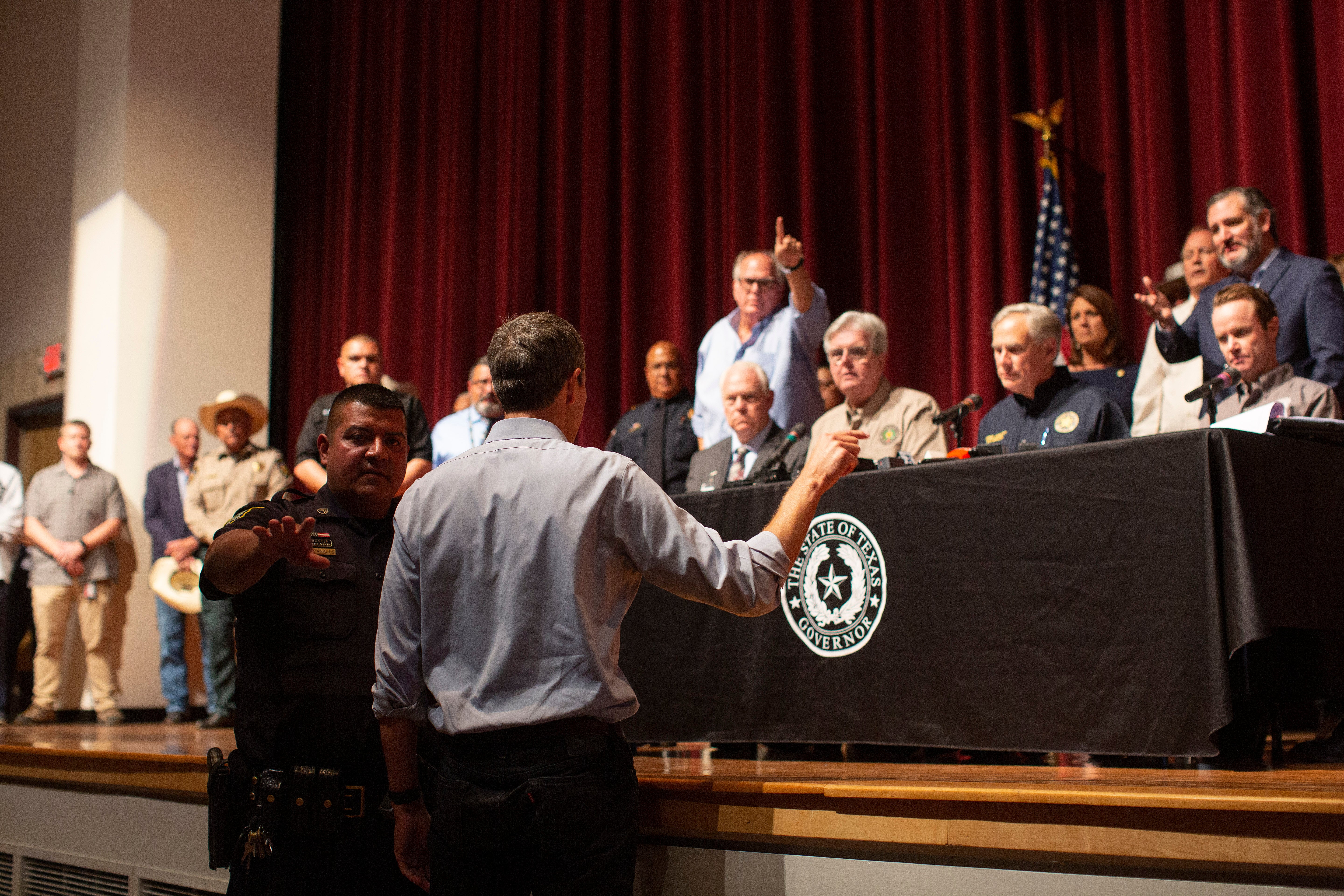 Democrat Beto O’Rourke, who is running against Abbott for governor this year, interrupts a news conference headed by Texas Gov. Greg Abbott in Uvalde, Texas