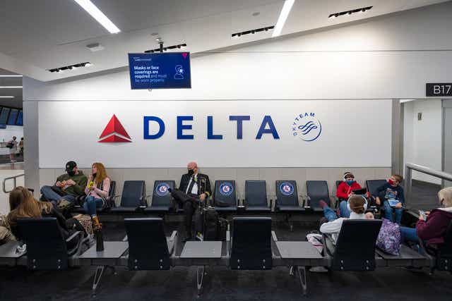 <p>Delta Air Lines passengers waiting at Atlanta’s airport</p>
