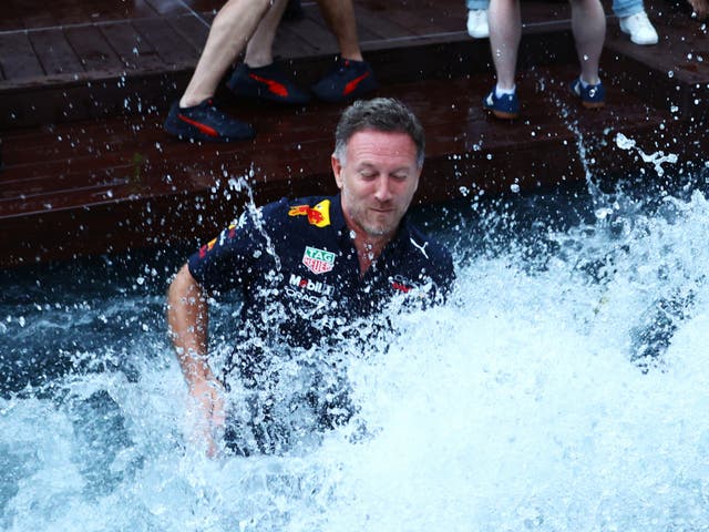 <p>Christian Horner celebrates in a trackside pool in Monaco</p>