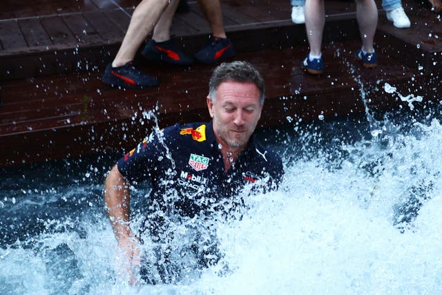<p>Christian Horner celebrates in a trackside pool in Monaco</p>