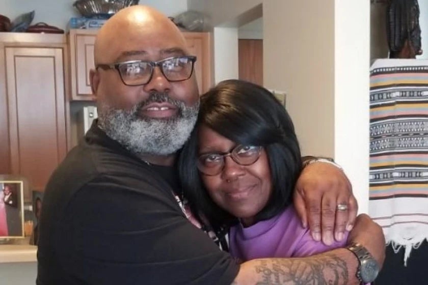 Veldarin Jackson hugs his mother, Janice Lee Reed, one of three seniors found dead at a Chicago senior apartment complex accused of causing its residents to die of heat-related complications during a May 2022 heat wave.