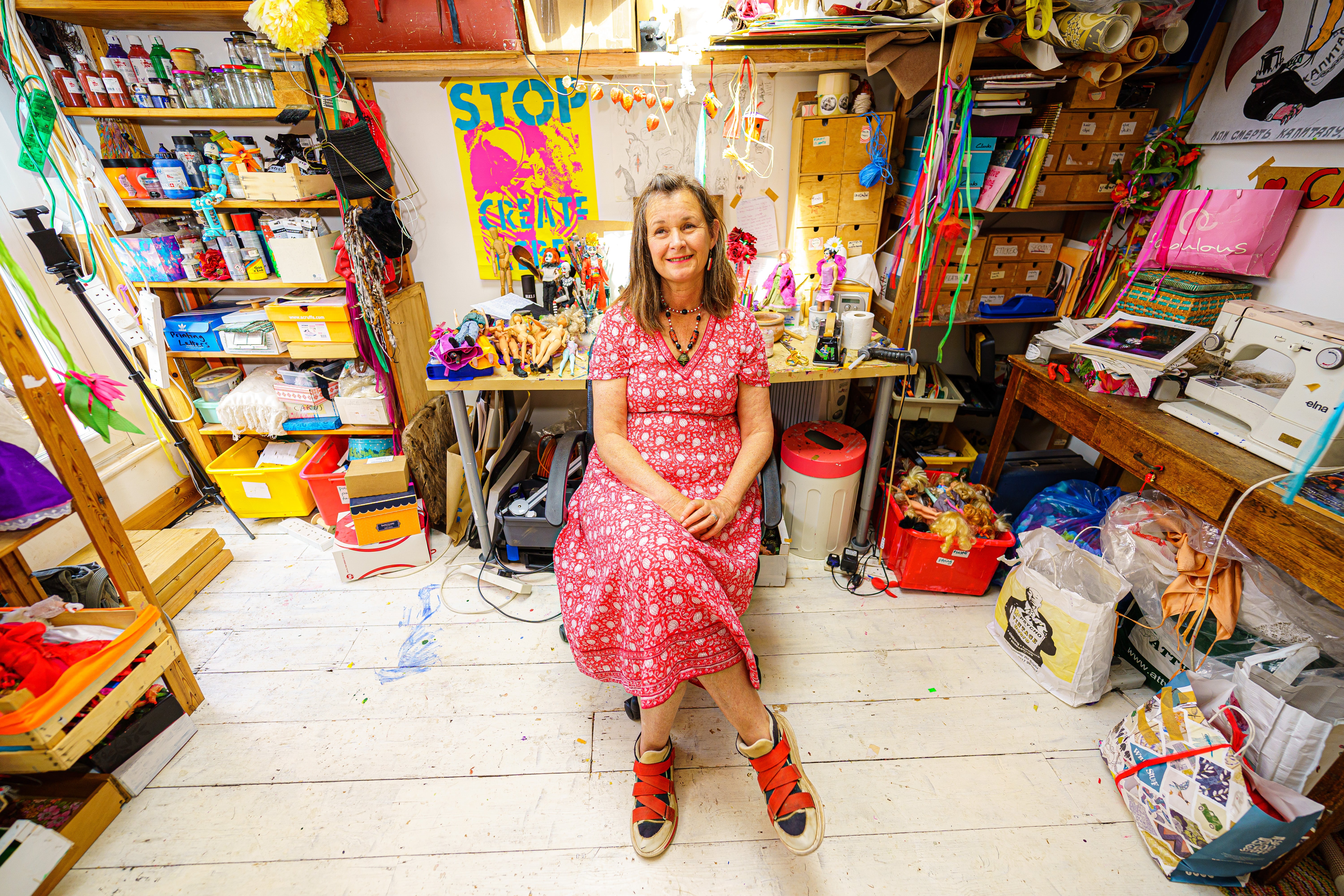 Artist Lou Gray, 61, at her home studio in Bristol, where she creates characters made from old dolls including Barbie, Ken and Action Man, plus other assorted miniature doll figures (Ben Birchall/PA Wire/PA Real Life)