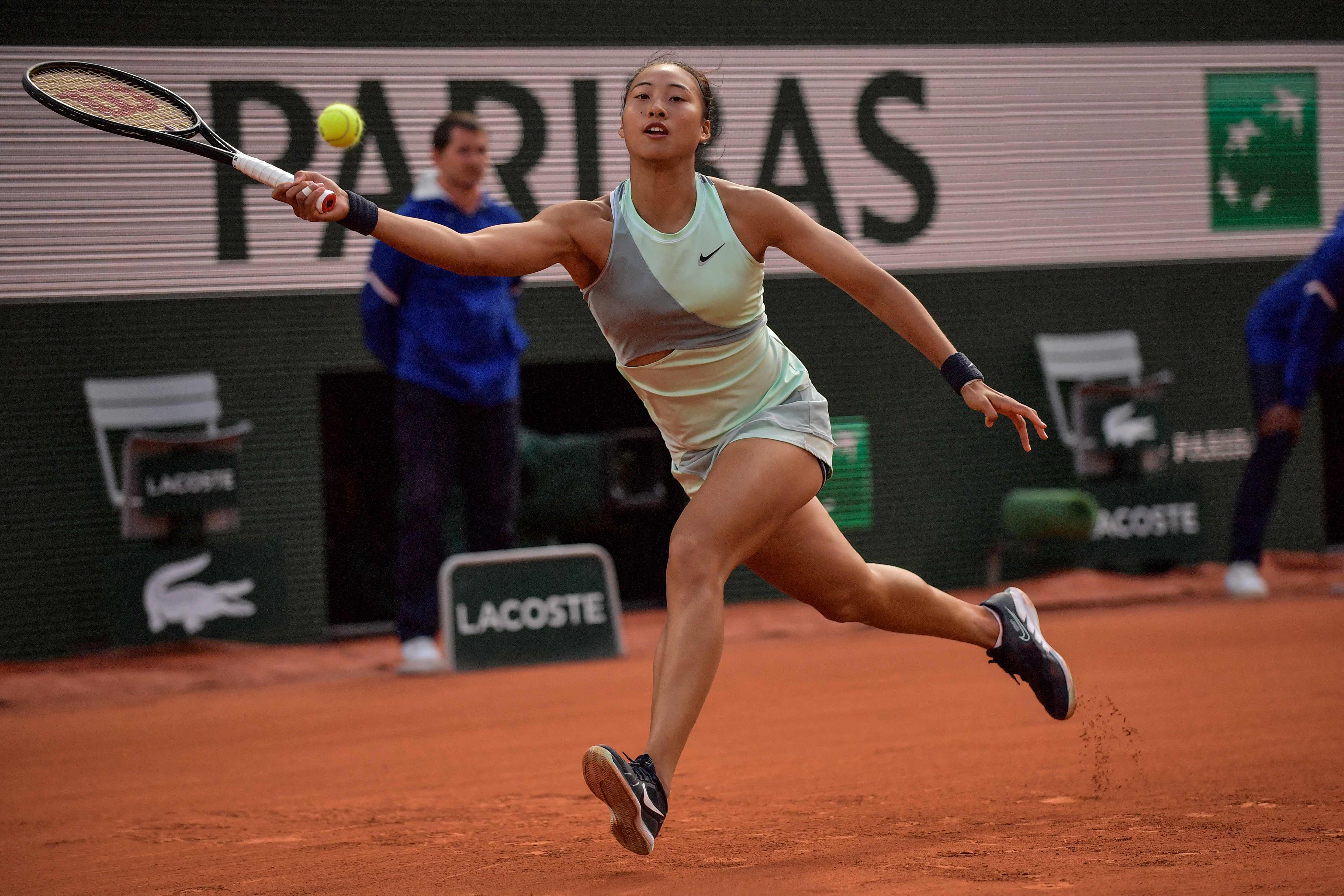 China's Zheng Qinwen returns the ball to Poland's Iga Swiatek during their women's singles match on day nine of the Roland-Garros Open tennis tournament