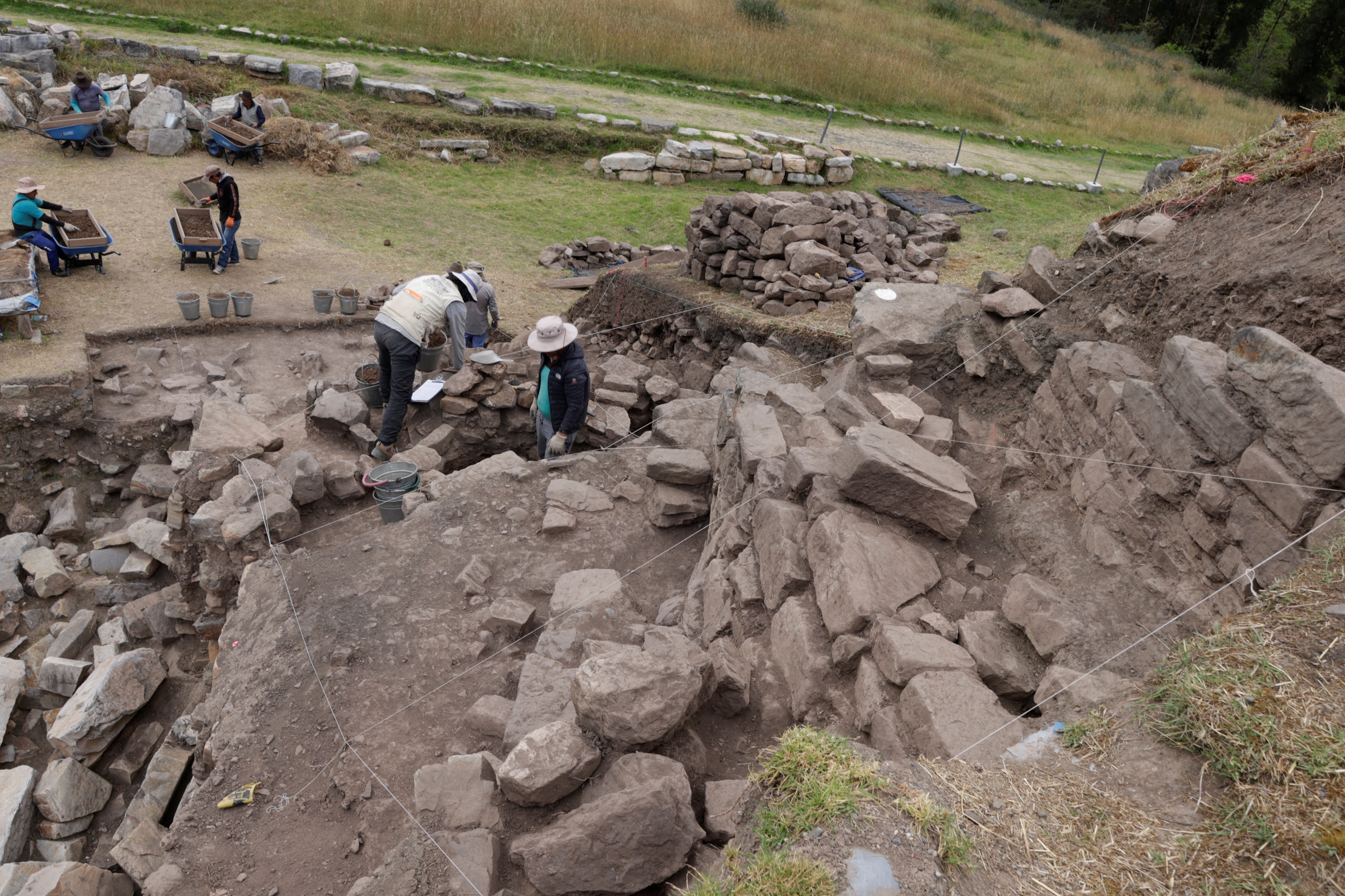Archaeologists work on the new discovery in the Peruvian Andes in Ancash