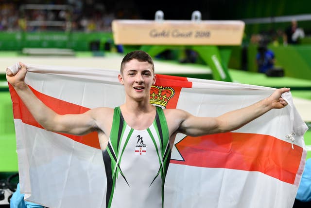 <p>Rhys McClenaghan celebrates after winning gold for Northern Ireland at the 2018 Commonwealths in Australia</p>