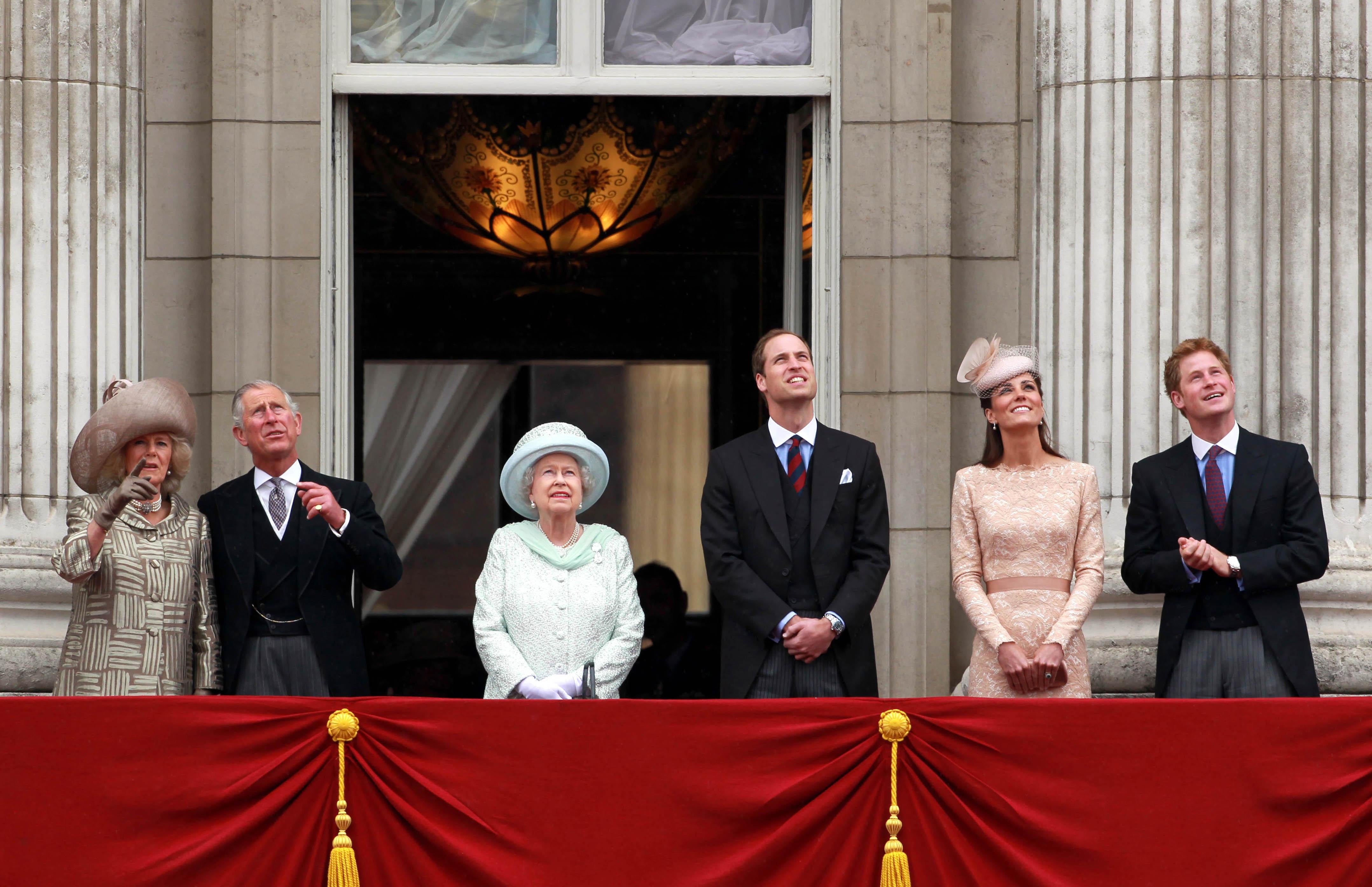 The Duchess of Cornwall, the Prince of Wales, the Queen, the Duke and Duchess of Cambridge and Prince Harry appear on the balcony of Buckingham Palace to watch the flypast during the Diamond Jubilee celebrations (David Davies/PA)