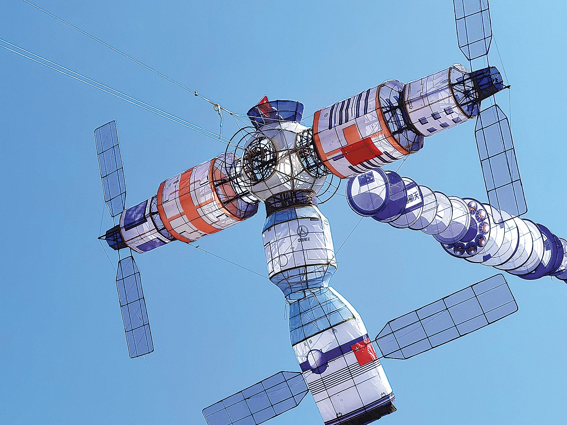 A kite in the shape of China’s Tiangong space station is flown in April in Weifang to celebrate the successful return of the three astronauts of the Shenzhou XIII mission