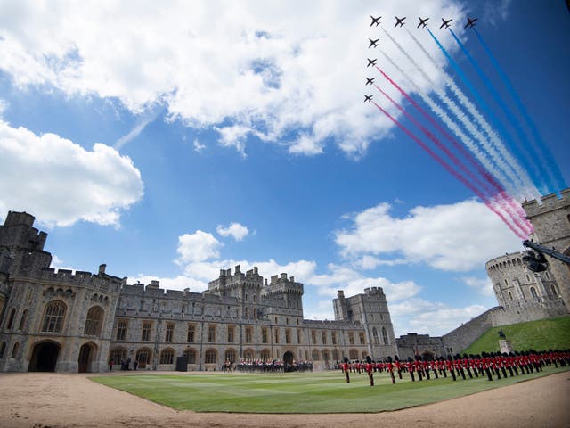 <p>The Red Arrows conduct a flypast as Britain's Queen Elizabeth II watches a military ceremony to mark her official birthday at Windsor Castle on June 12, 2021</p>