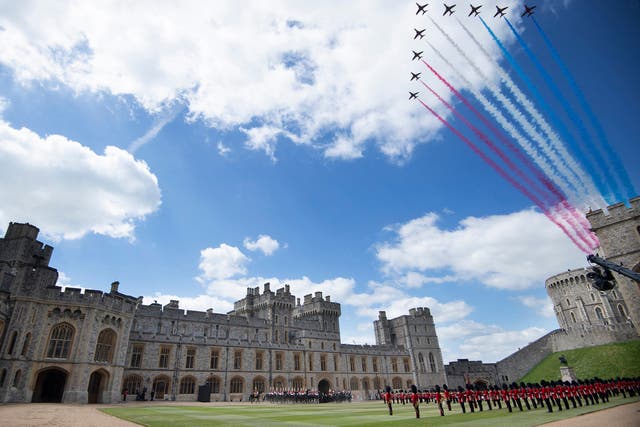 <p>The Red Arrows conduct a flypast as Britain's Queen Elizabeth II watches a military ceremony to mark her official birthday at Windsor Castle on June 12, 2021</p>
