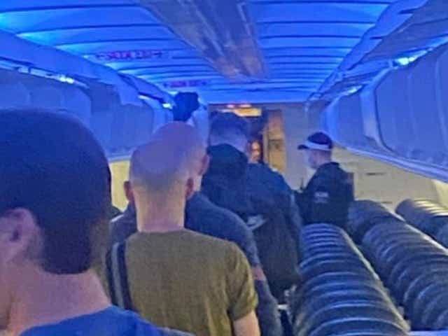 <p>Tui passengers escorted off plane by police</p>