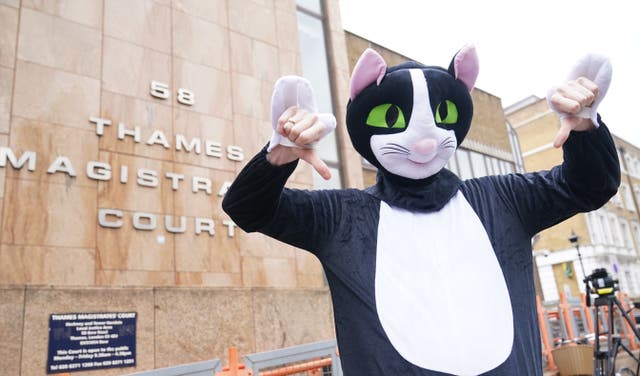 <p>A person dressed as a cat outside Thames Magistrates’ Court (Yui Mok/PA)</p>