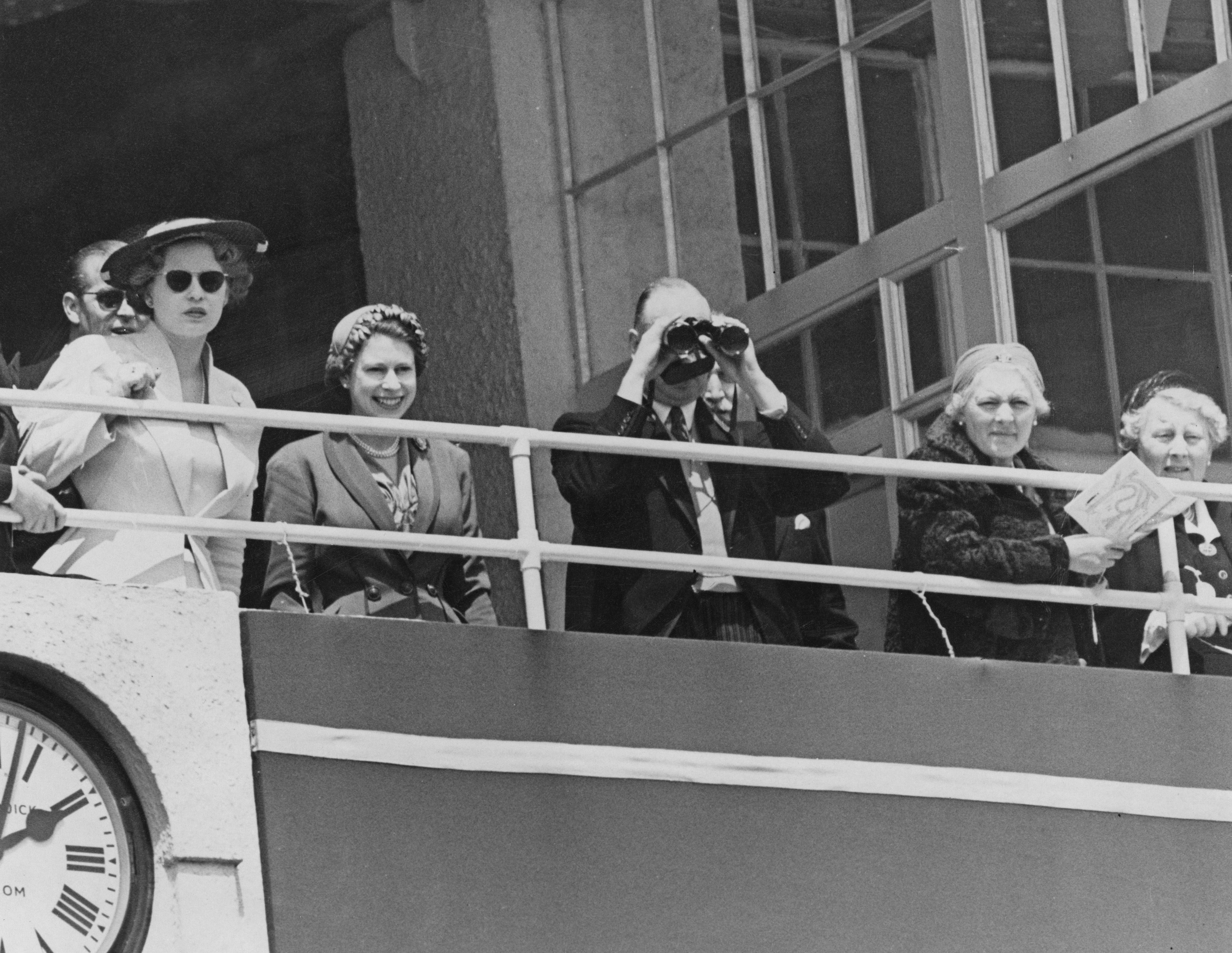 Queen Elizabeth II (second left) in the royal box at the Derby, Epsom Downs Racecourse, Surrey, in June 1953