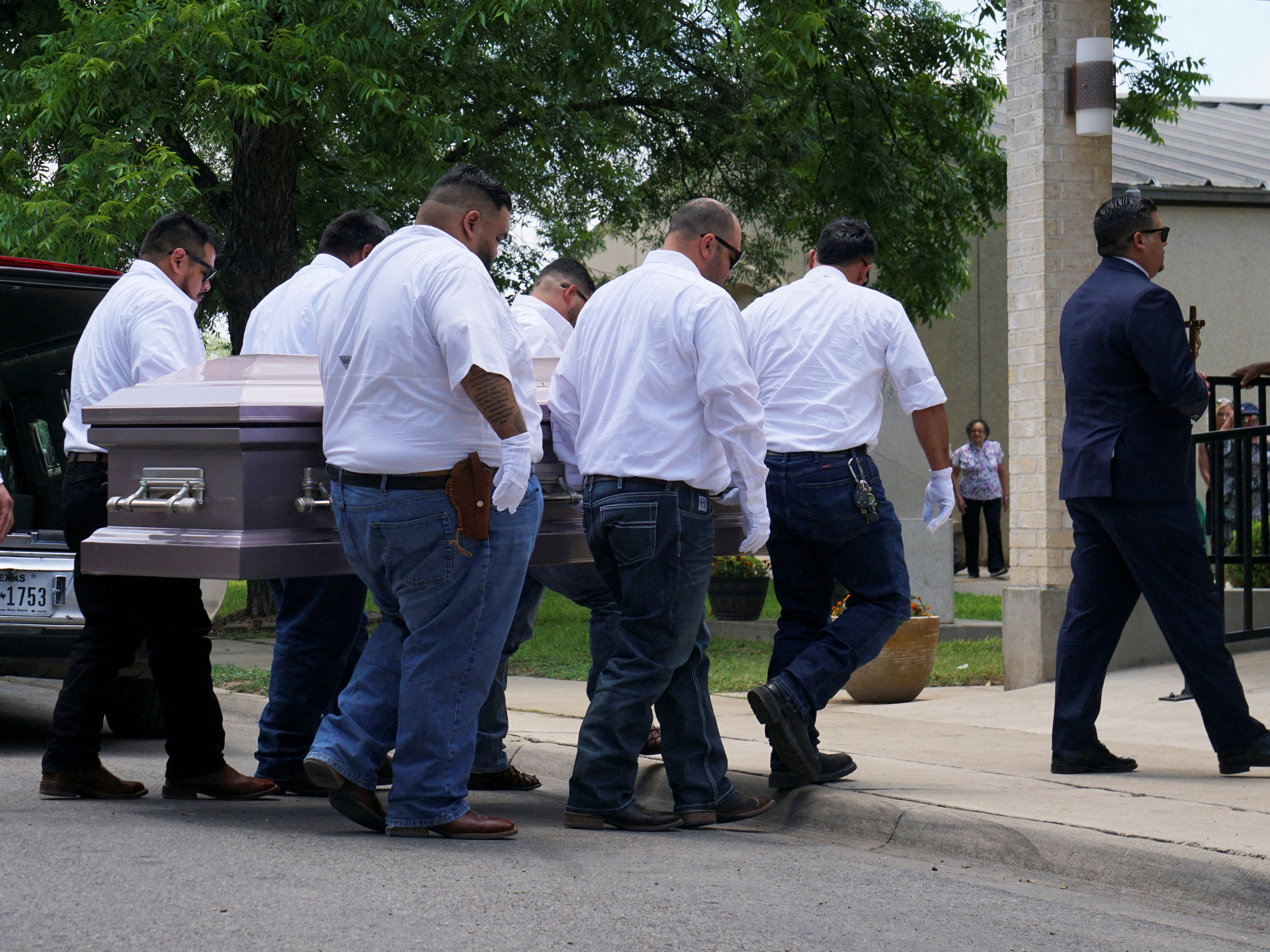 Pallbearers carry the coffin of Amerie Jo Garza