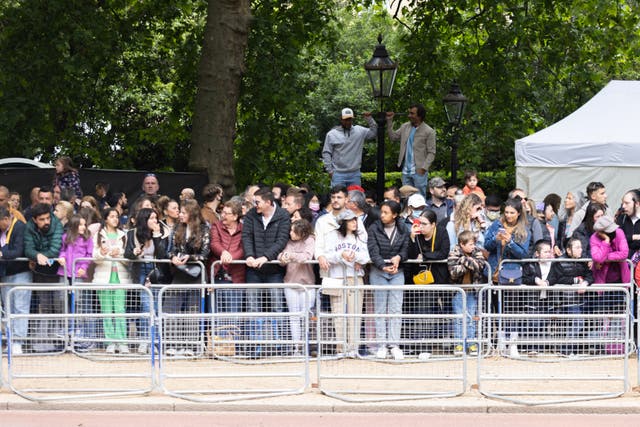 Crowds line The Mall, in central London, where well-wishers are already camping out for the best spots (James Manning/PA)