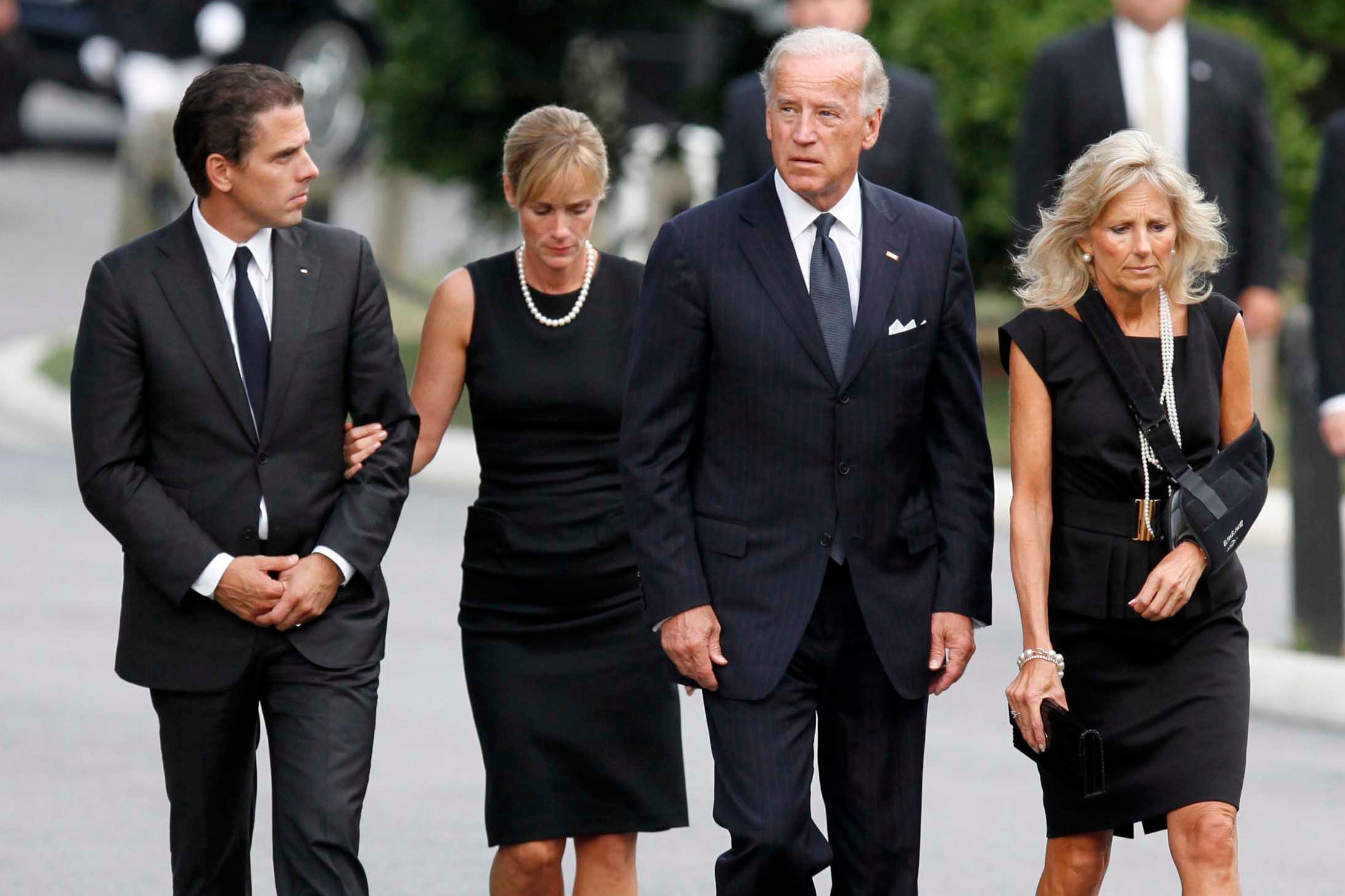 Hunter Biden (far left) walks with his then-wife Kathleen Buhle (center left) in 2009