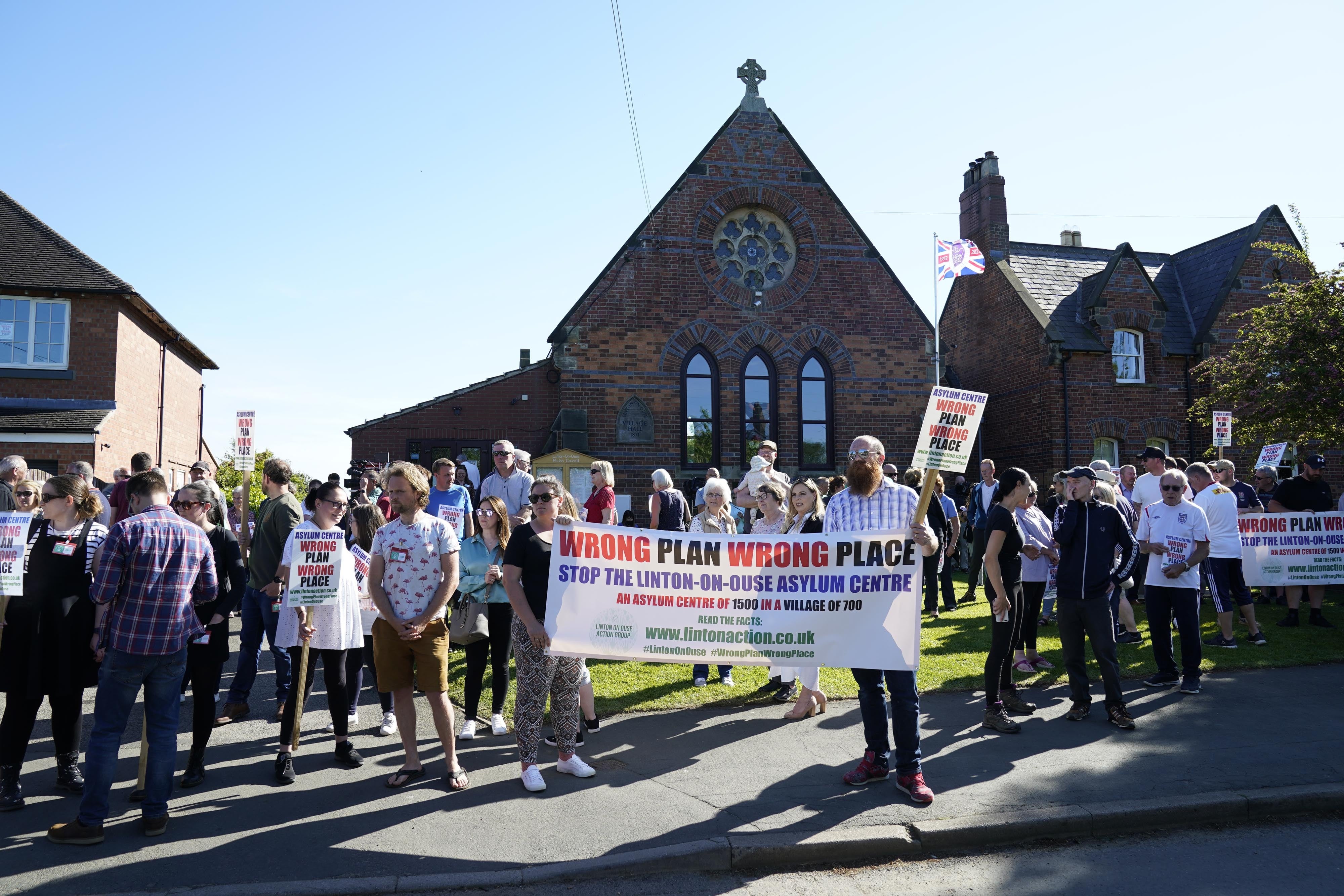 Campaigners outside Linton-on-Ouse Village Hall, North Yorkshire (PA)