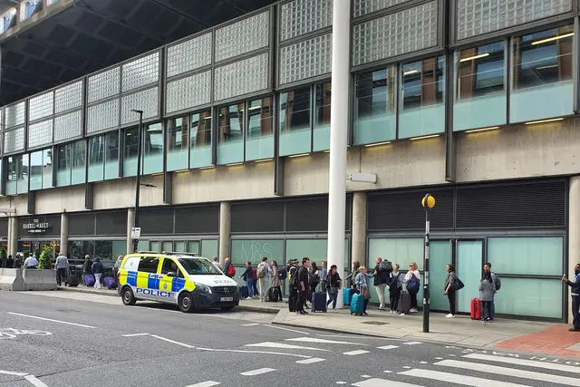 <p>Passengers waiting outside St Pancras station on Tuesday </p>