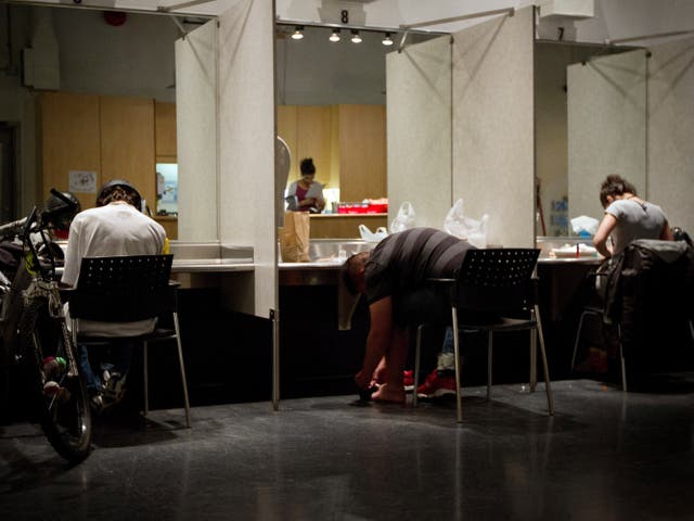 <p>Addicts inject themselves at the Insite supervised injection Center in Vancouver, Canada, on May 3, 2011</p>