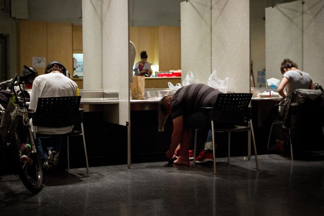 <p>Addicts inject themselves at the Insite supervised injection Center in Vancouver, Canada, on May 3, 2011</p>