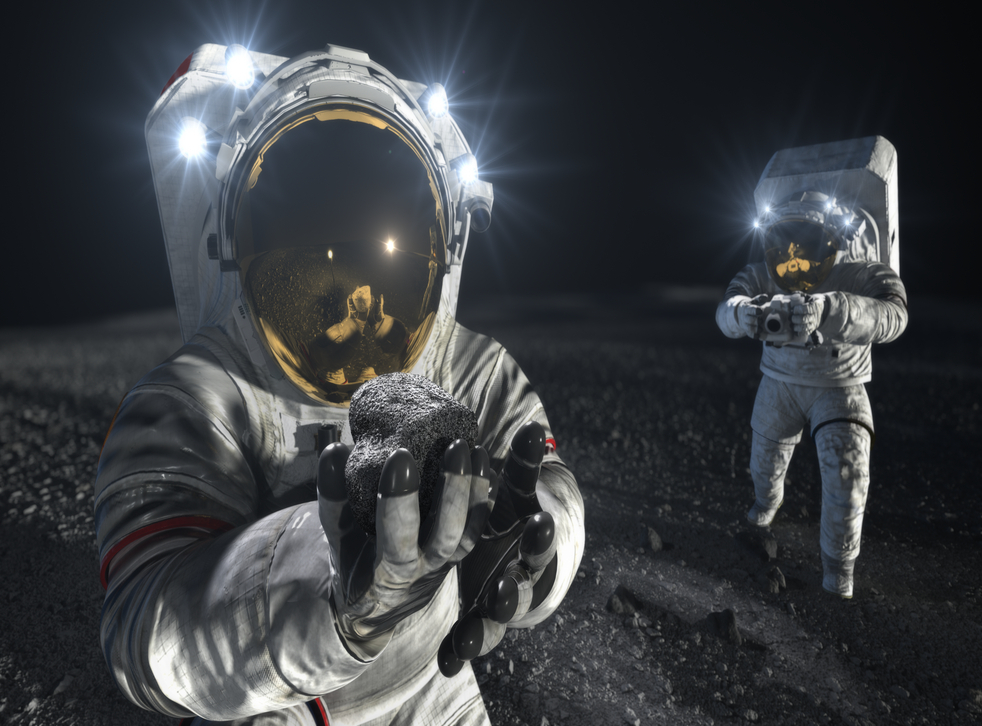 <p>An artists conception of Nasa astronauts using new spacesuits on the Moon</p>