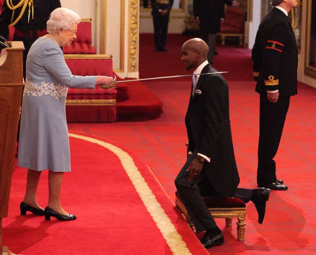 Mo Farah is made a Knight Bachelor of the British Empire by Queen Elizabeth at Buckingham Palace (Yui Mok/PA)