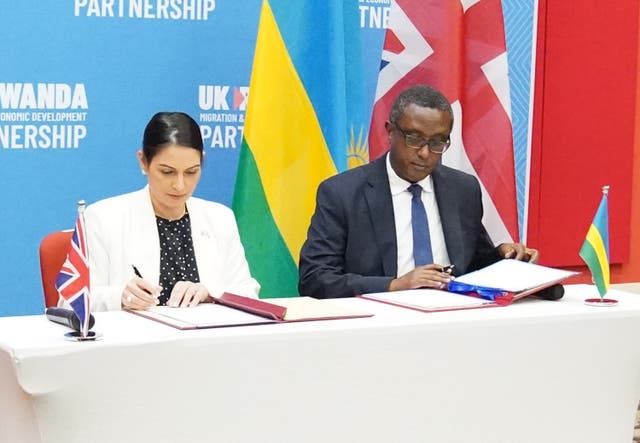 Home Secretary Priti Patel and Rwandan minister Vincent Biruta sign a migration and economic development partnership (PA)