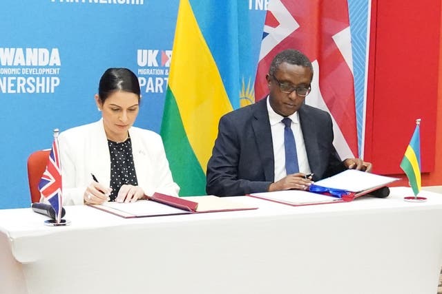 Home Secretary Priti Patel and Rwandan minister Vincent Biruta sign a migration and economic development partnership (PA)