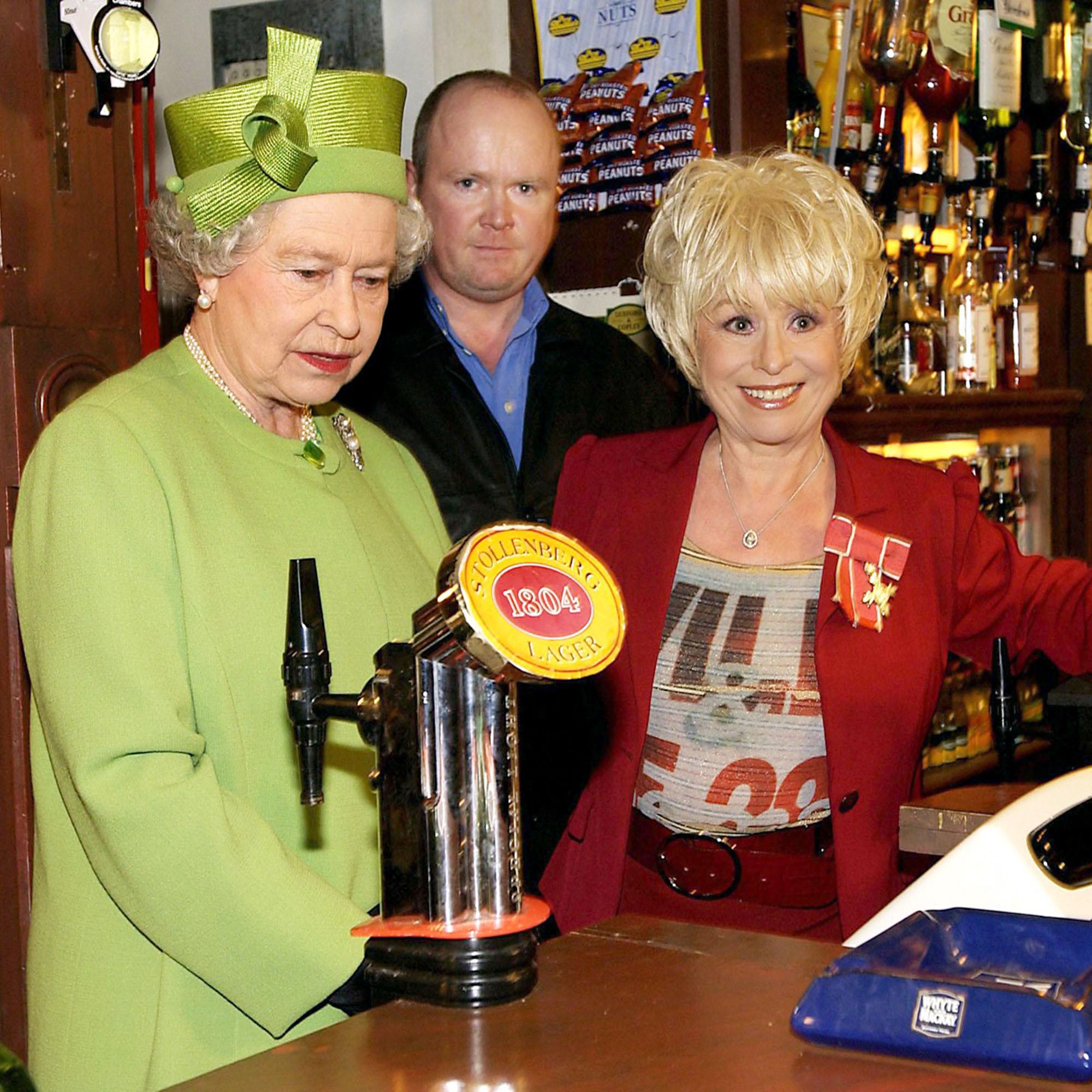 The Queen in the Queen Vic pub during a visit to Elstree Studios (Fiona Hanson/PA)
