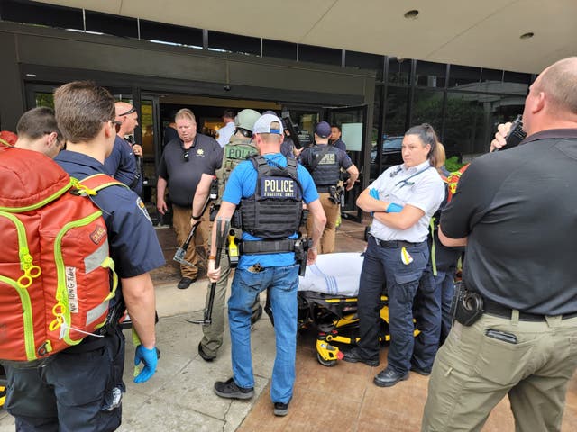 <p>Police and medics respond to a mass shooting at the St Francis Hospital in Tulsa, Oklahoma on 1 June</p>