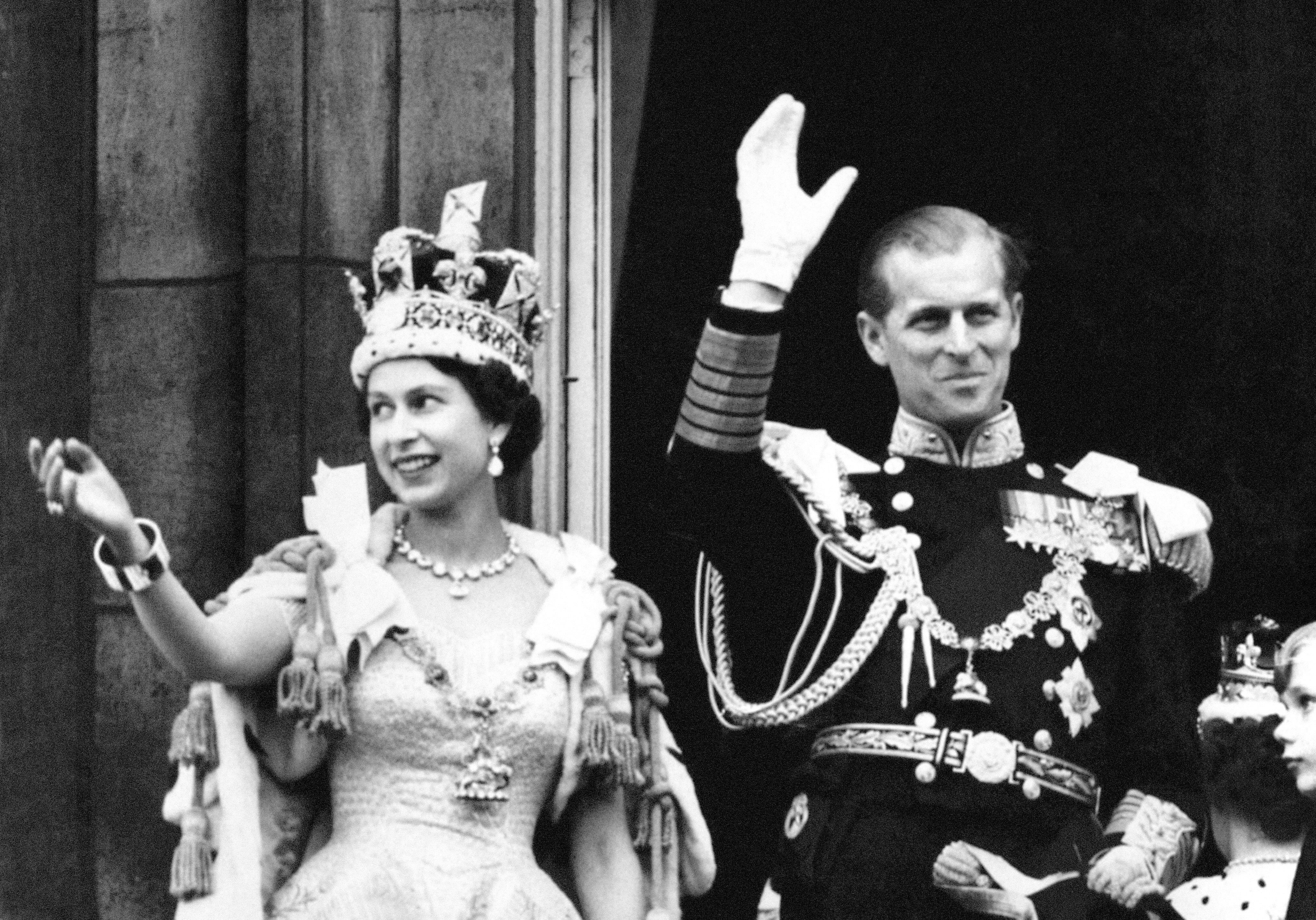 The Queen wearing the Imperial State Crown, and the Duke of Edinburgh, after the Coronation (PA)