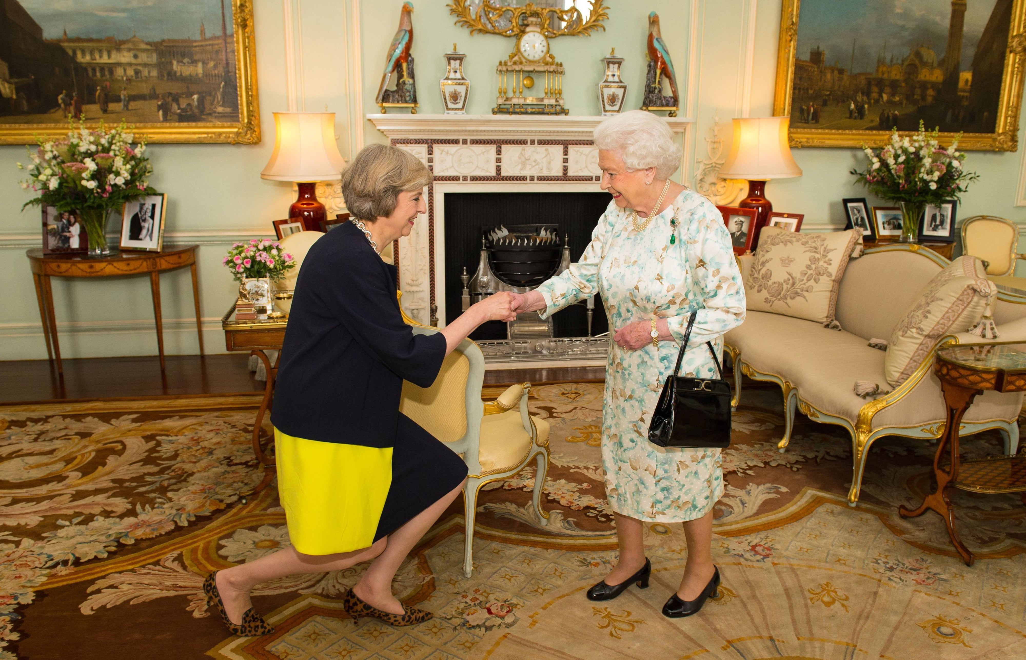 The Queen welcoming Theresa May as she invited the former home aecretary to become prime minister and form a government in 2016 (Dominic Lipinski/PA)