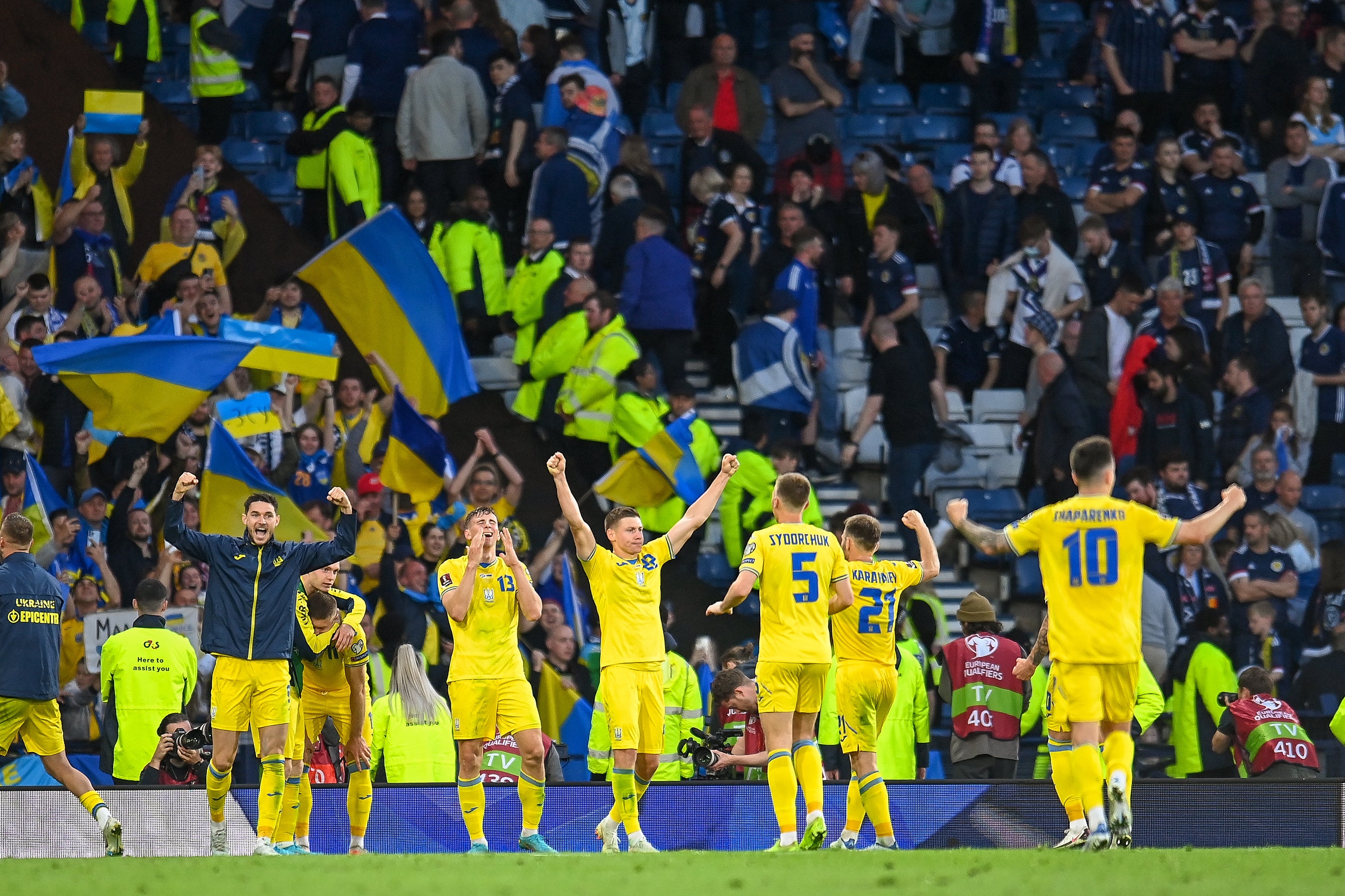 The Ukrainian team celebrate at the final whistle (Malcolm Mackenzie/PA)
