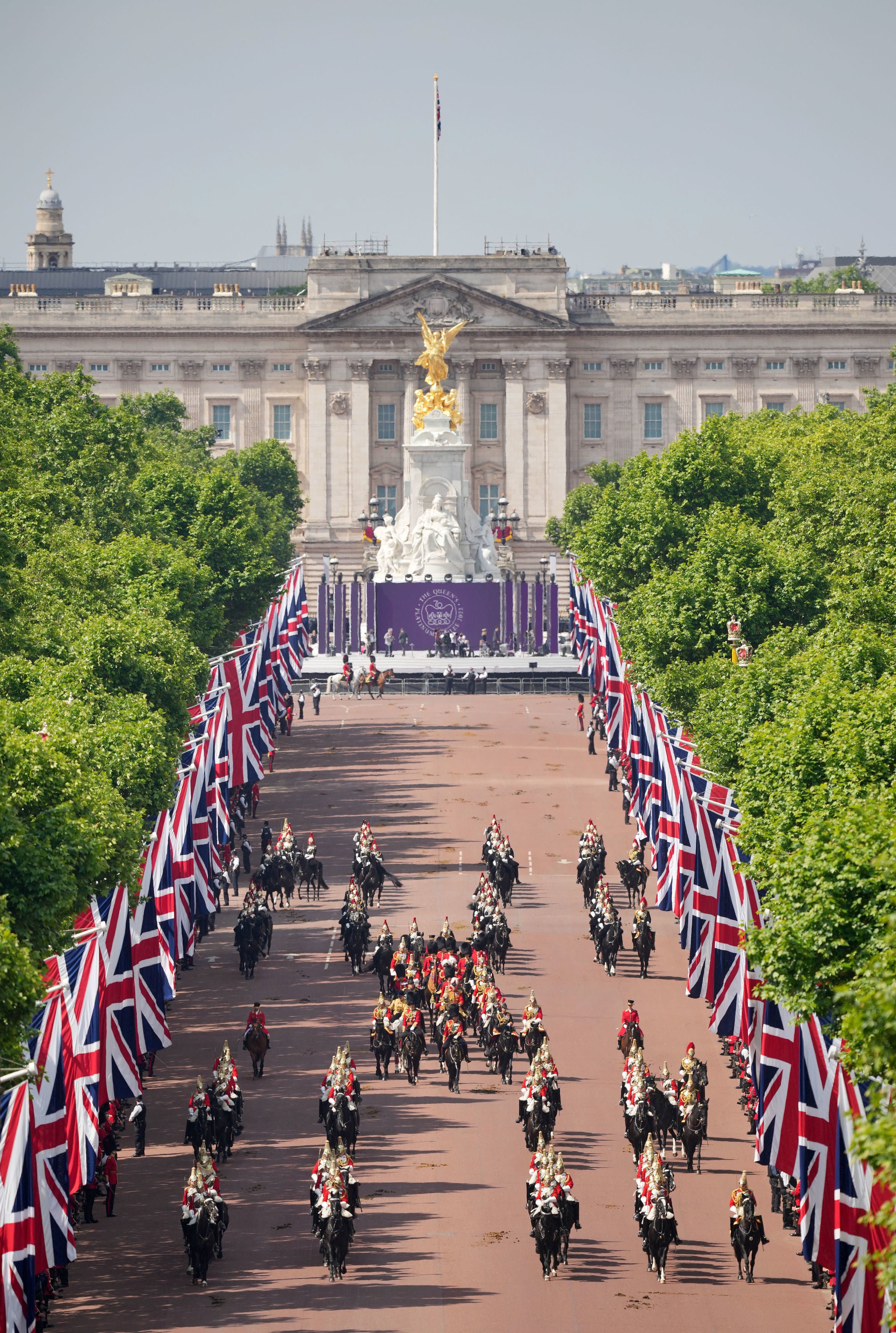 Scenes on The Mall as the Royal Procession prepares to leave Buckingham Palace for the Trooping the Colour ceremony at Horse Guards Parade