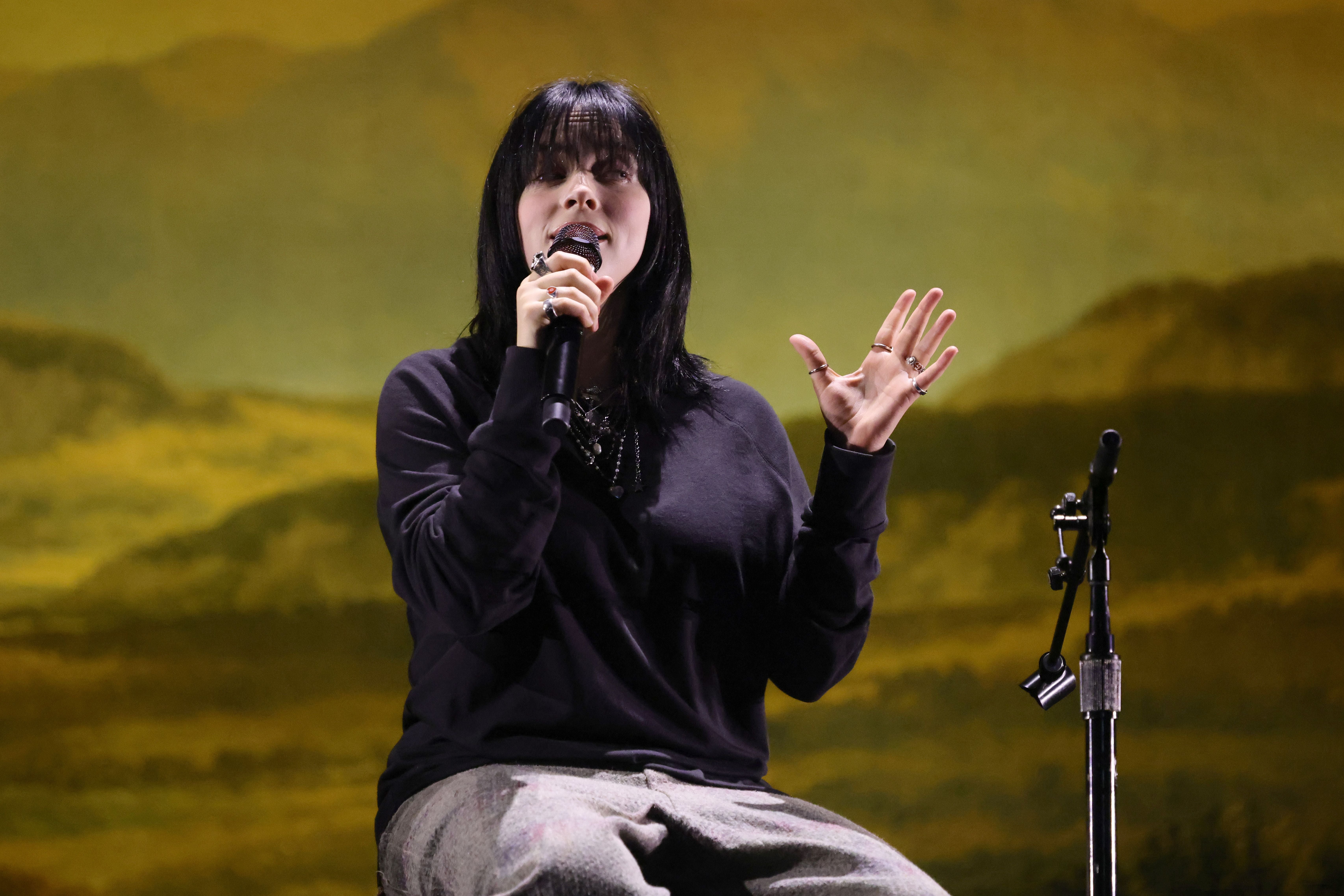 Are you sitting comofortably? Billie Eilish commands the stage with just a stool