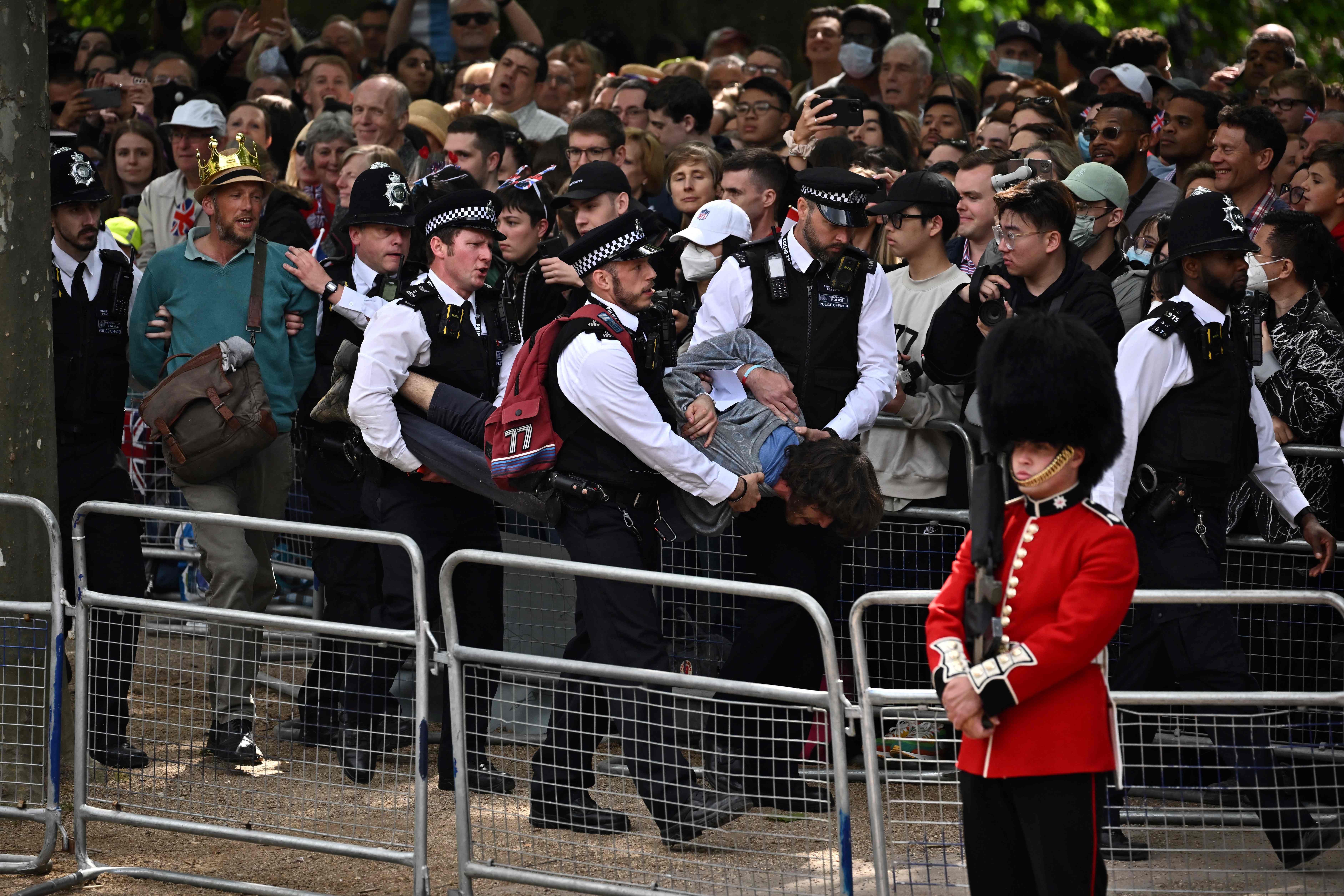 Crowds booed as the protesters were taken away