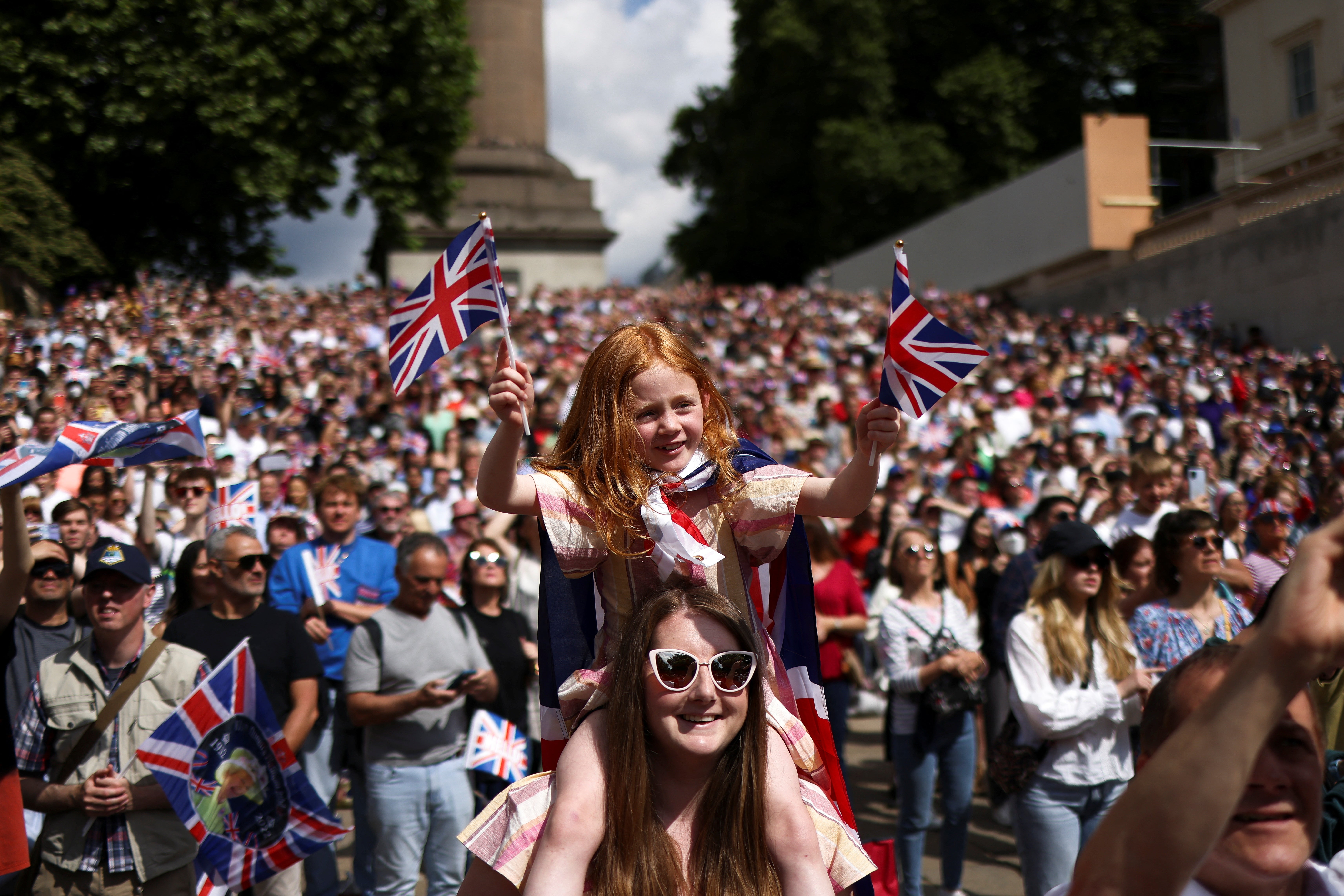 People attend celebrations of Britain's Queen Elizabeth's Platinum Jubilee, along The Mall