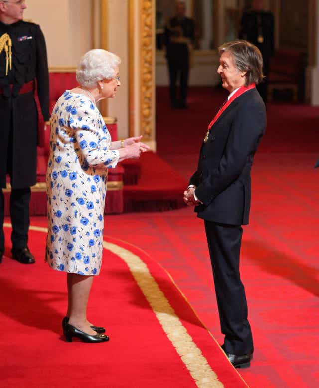 Sir Paul McCartney is made a Companion of Honour by the Queen during an investiture ceremony at Buckingham Palace (Yui Mok/PA)