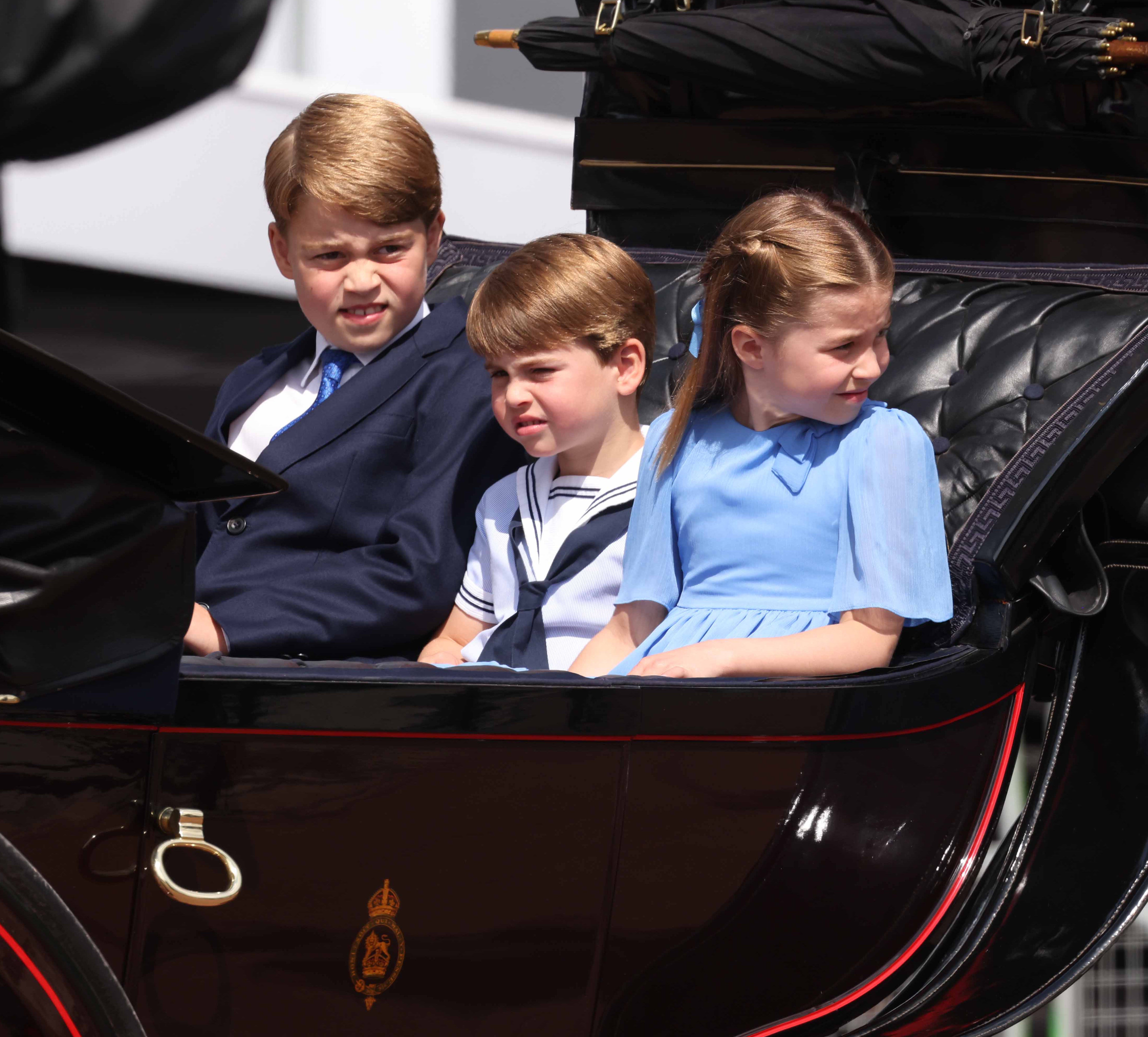 Prince George, Prince Louis and Princess Charlotte ride in a carriage as the Royal Procession leaves Buckingham Palace (Ian Vogler/Daily Mirror/PA)
