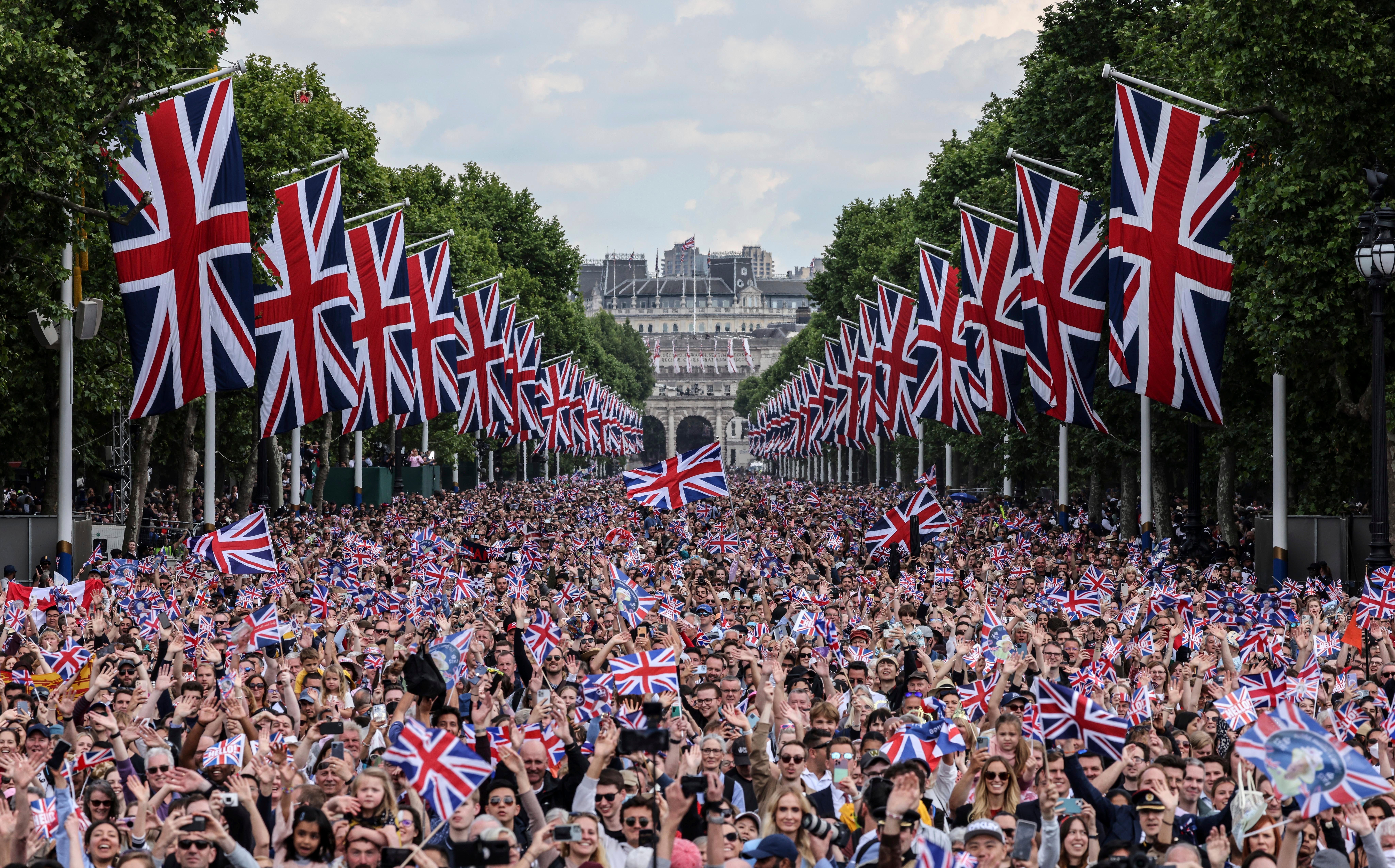 The crowd fill The Mall as they wait for the royal family to appear on the balcony of Buckingham Palace