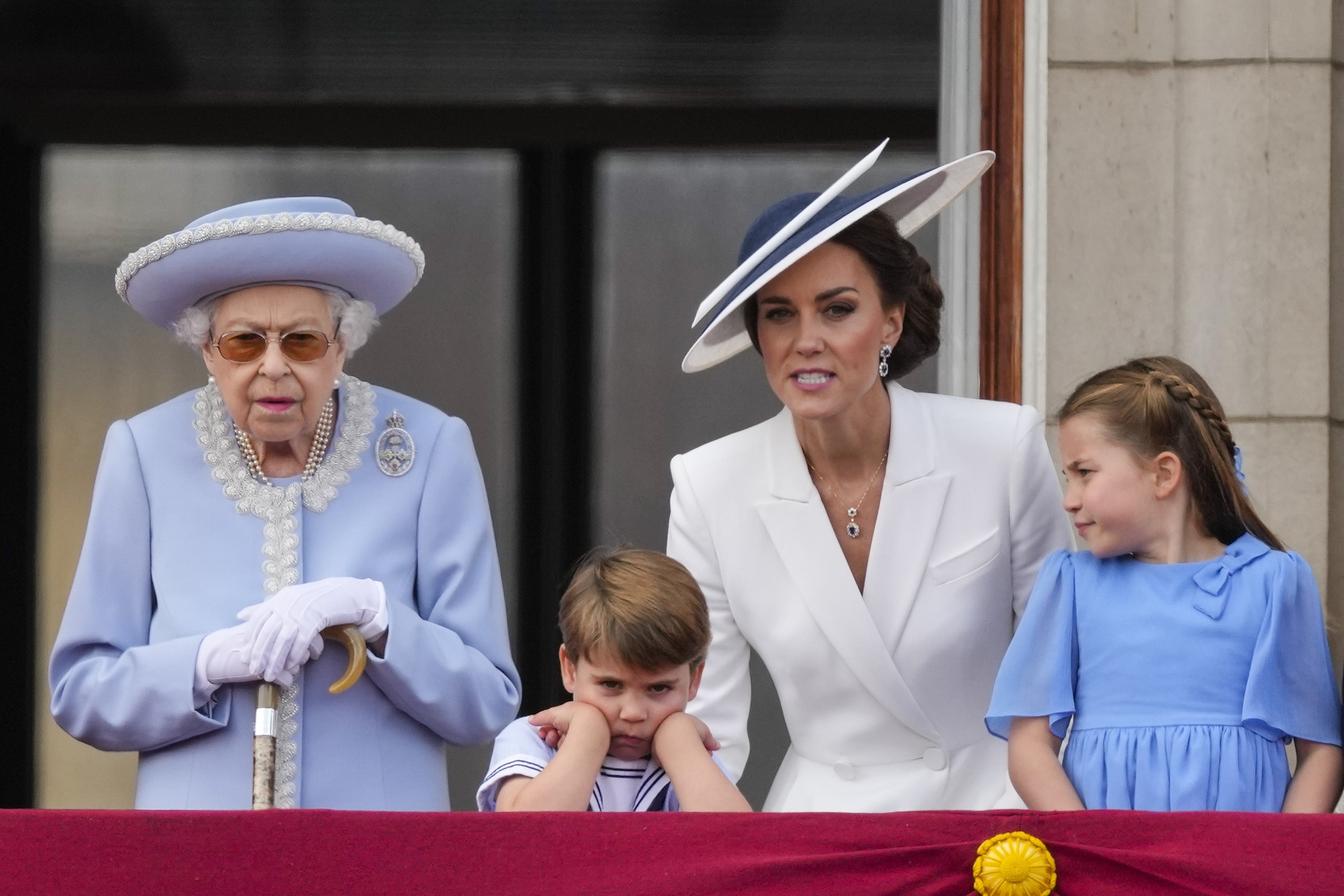 The Queen, Prince Louis, the Duchess of Cornwall and Princess Charlotte on the balcony of Buckingham Palace